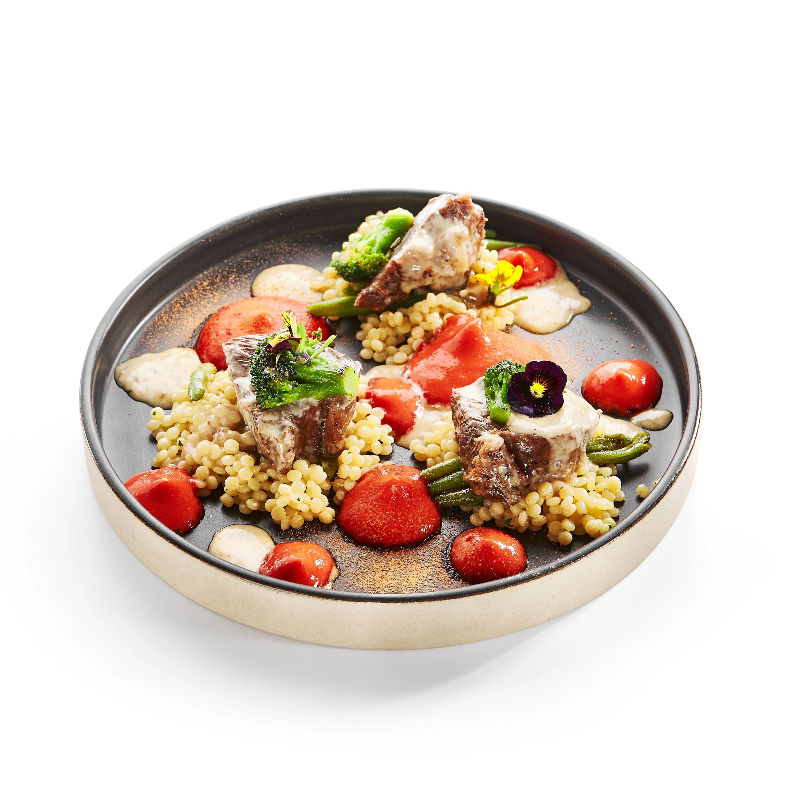 Braised calf cheeks with couscous and greens