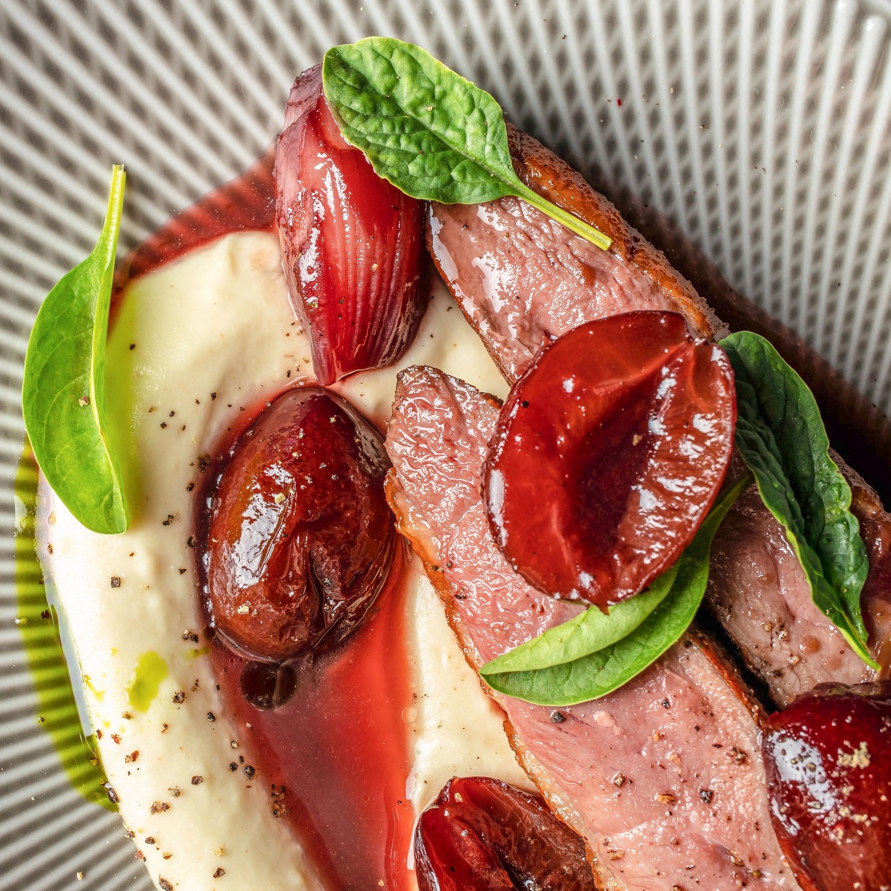 Signature plated duck dish at Bella munela